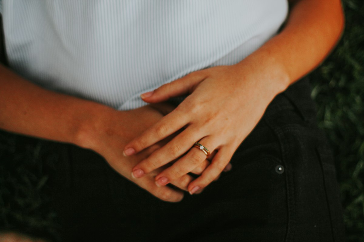 Hands resting gently on a belly
